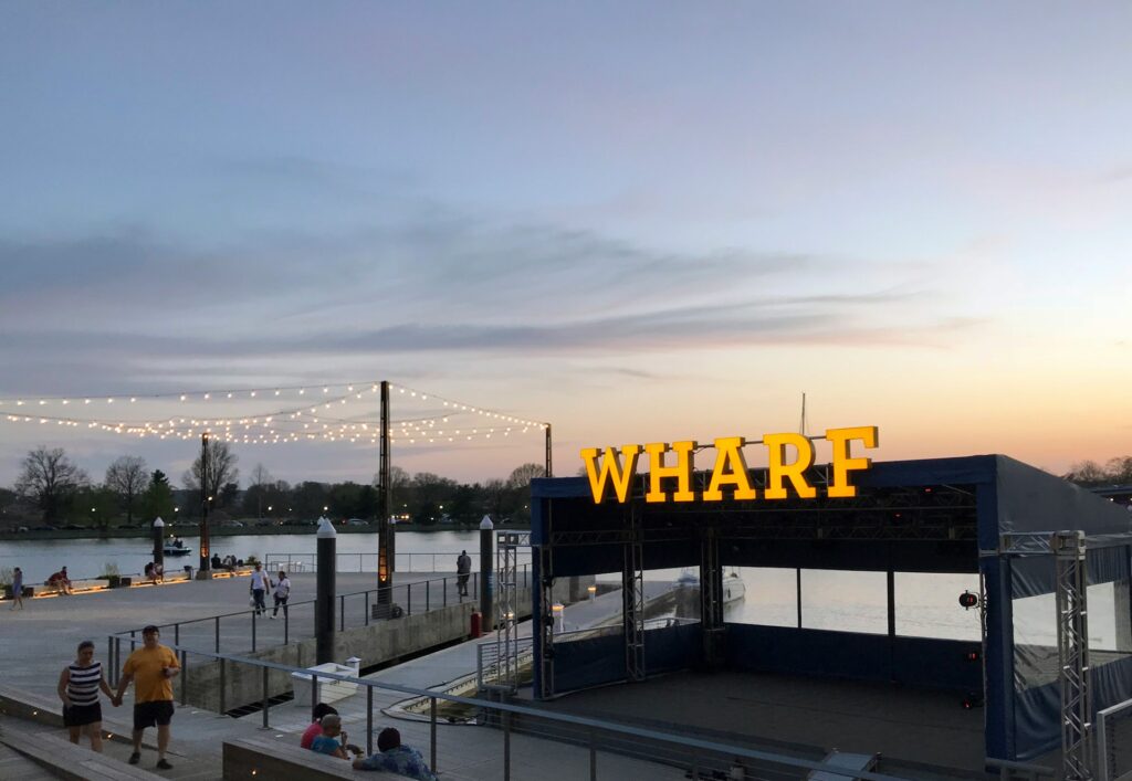 a photo of the washington dc wharf at sunset